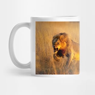 Aggressive young lion charging Mug